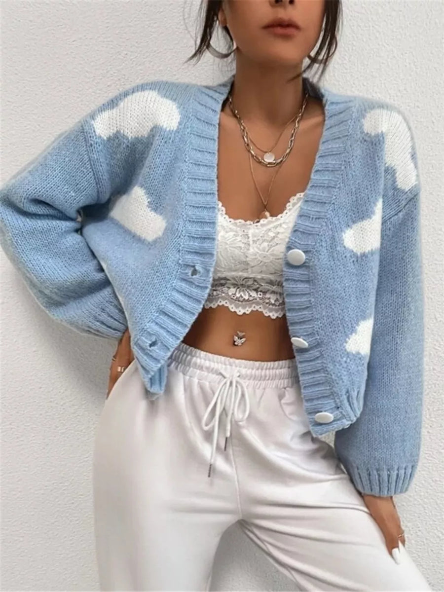 Light blue acrylic button cardigan with white cloud pattern and V-neck.