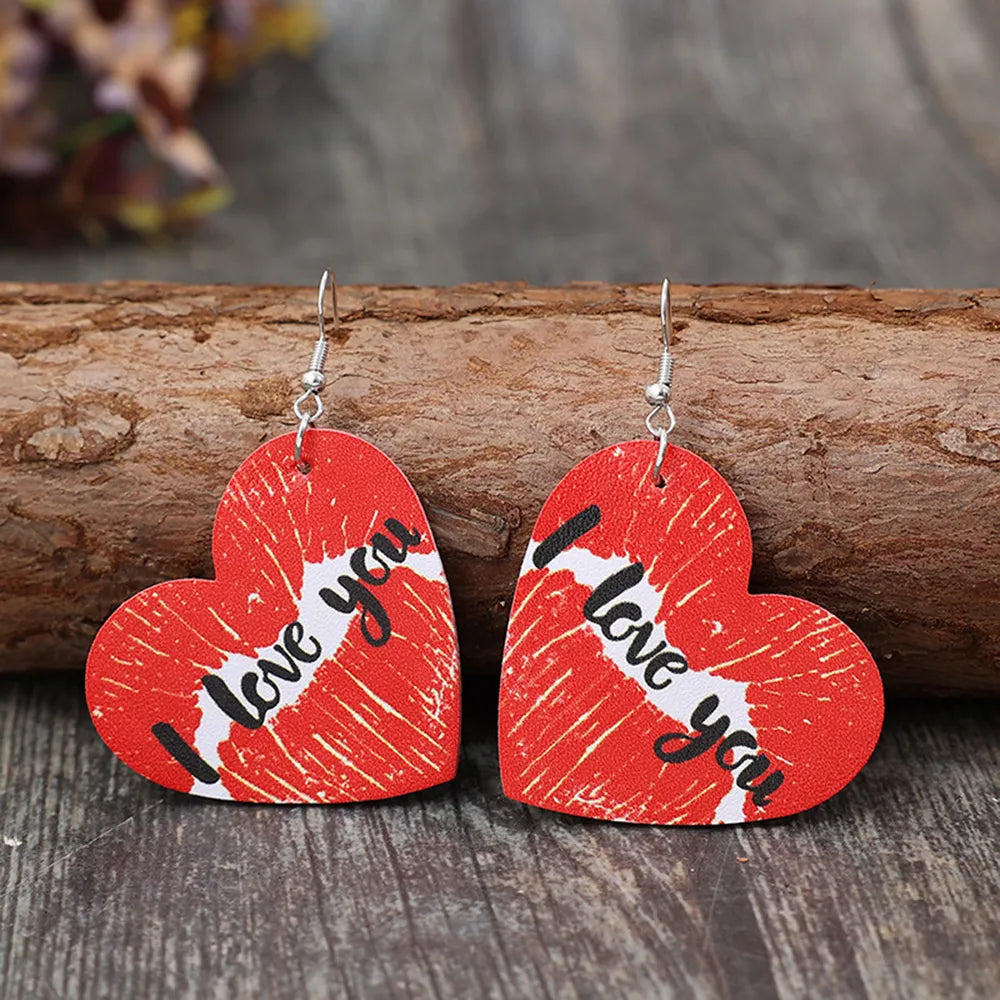 Red heart drop earrings with kiss print and "I love you" text