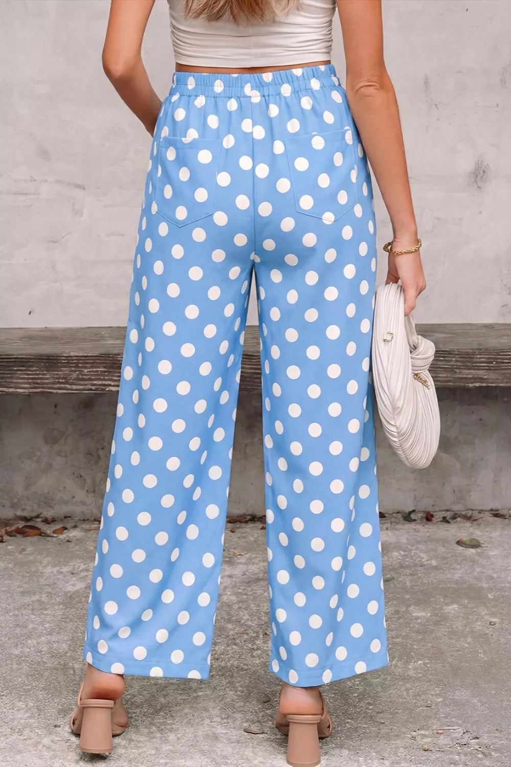 Blue polka dot cropped pants with pockets and elastic waist.