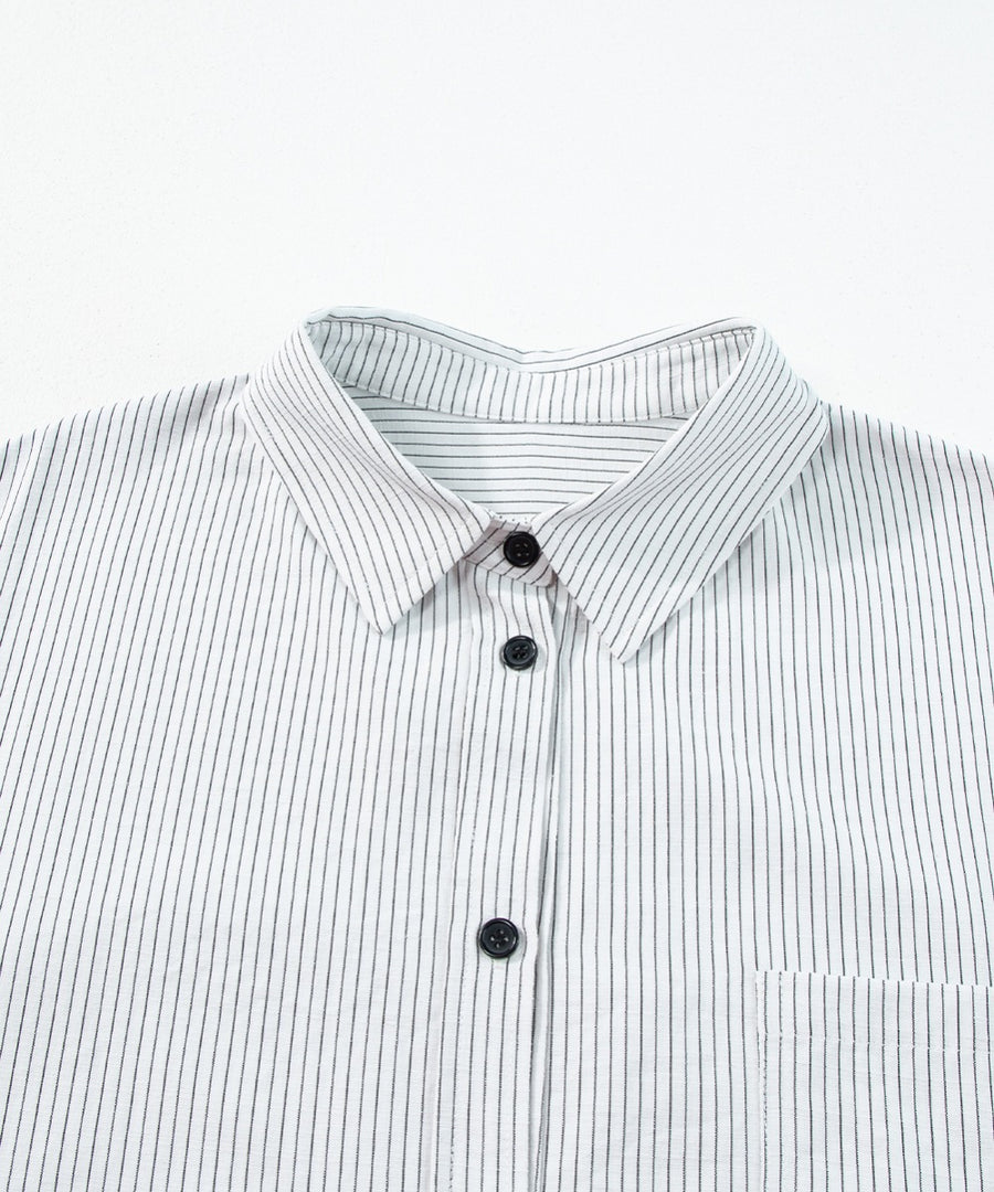 White button-down shirt with black pinstripes and a chest pocket.