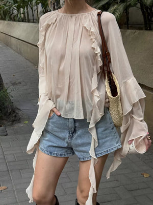 100% polyester Care instructions: Machine wash cold blouse in Eggshell with loose silhouette