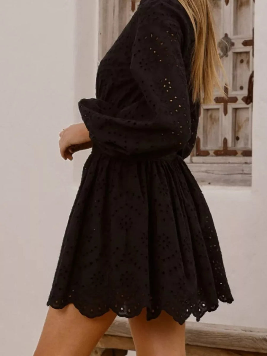 Black eyelet mini dress with balloon sleeves and scalloped hem