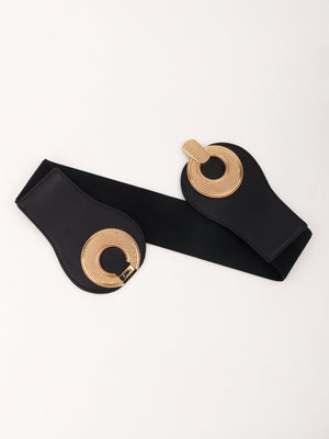 Black elastic belt with sculpted gold metalwork circular detail and clasp.
