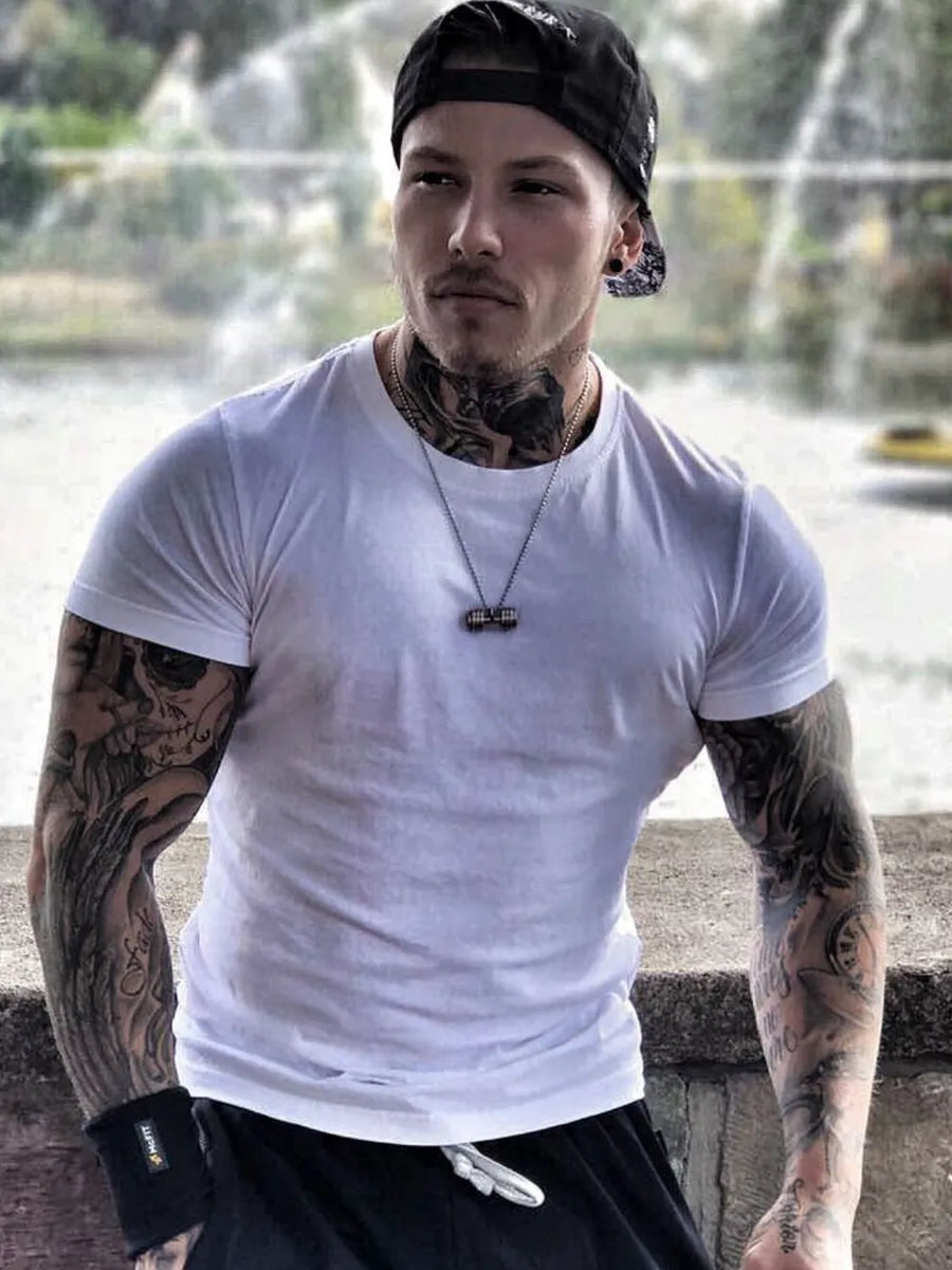 White crew neck t-shirt with short sleeves, a muscle fit, and a casual style.