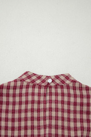 Burgundy plaid long sleeve blouse with button keyhole detail at back neck.