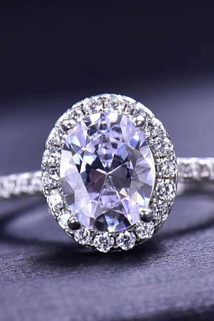 Halo oval diamond engagement ring in white gold with a sparkling halo setting.