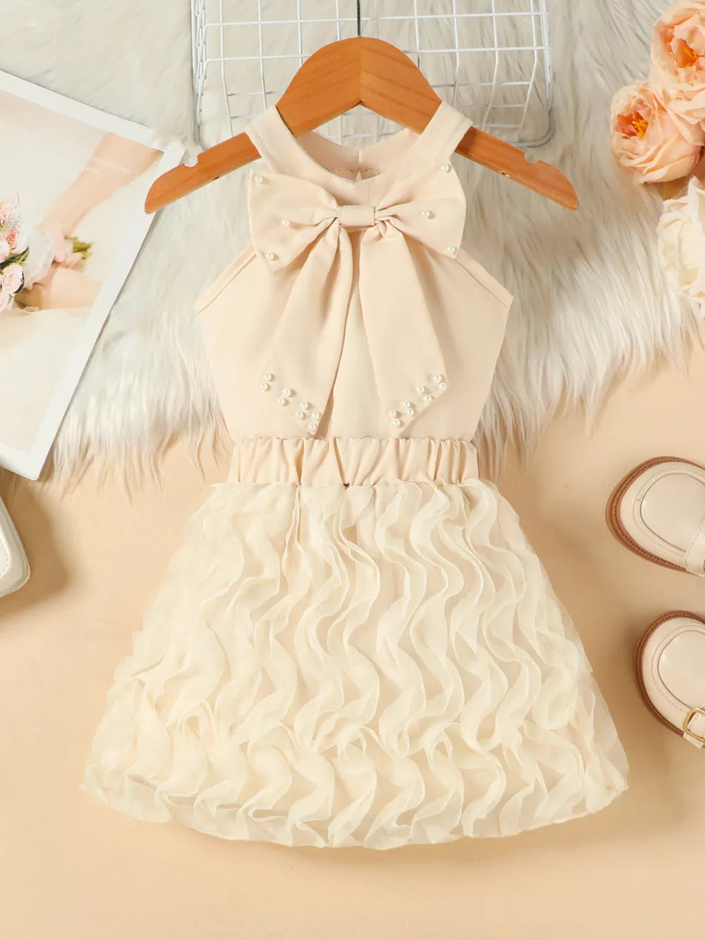 Beige toddler dress with pearl bowknot and ruffled skirt