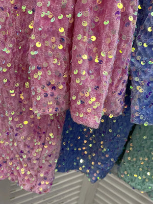 Pink and blue t-shirts with iridescent sequin embellishments and a crew neck.