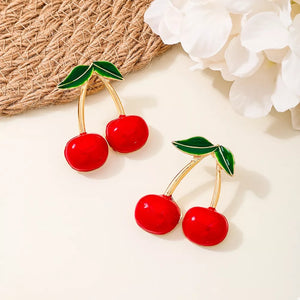gold earrings featuring dangle and fruit motif