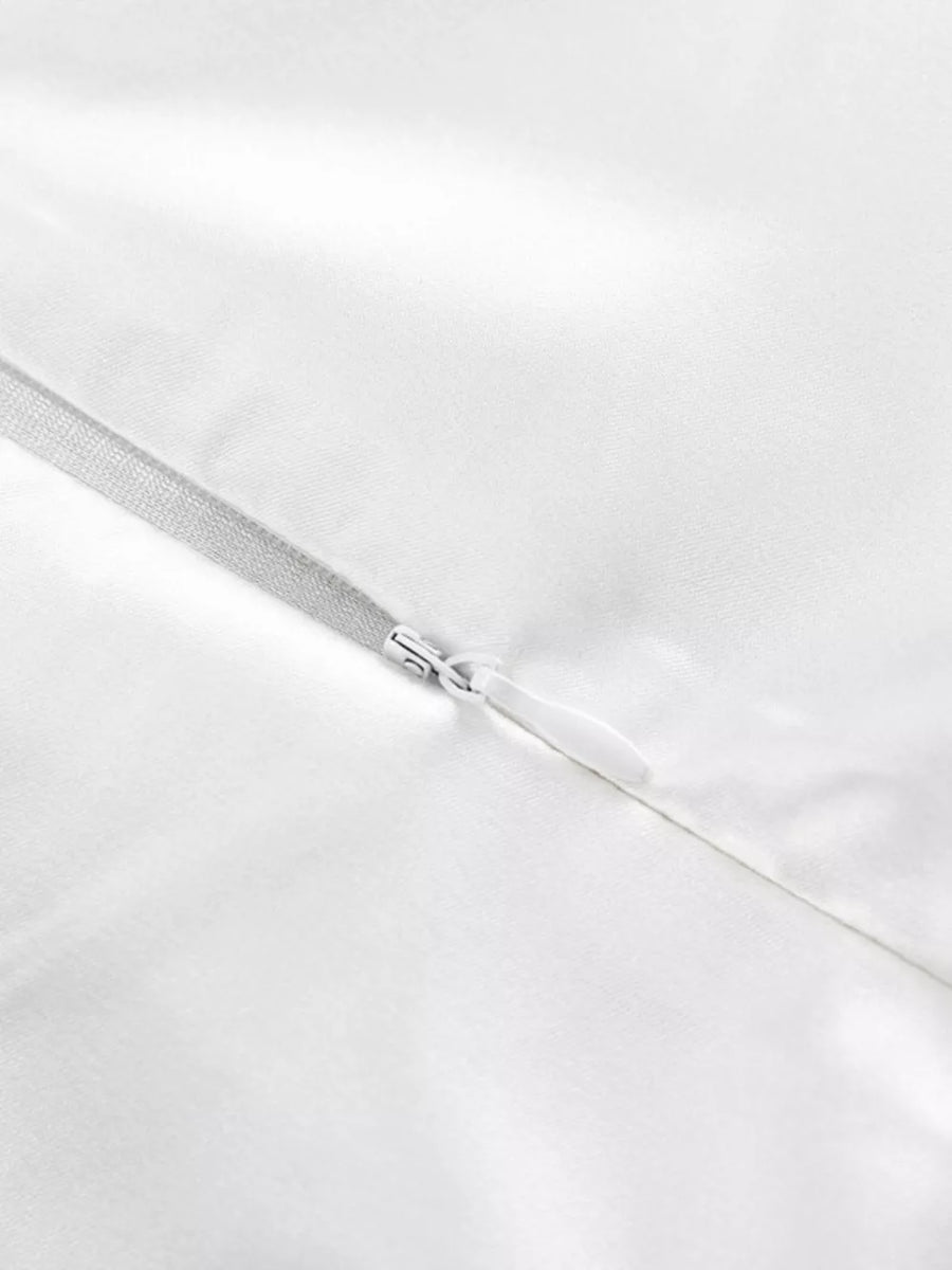 White satin dress with a silver zipper detail