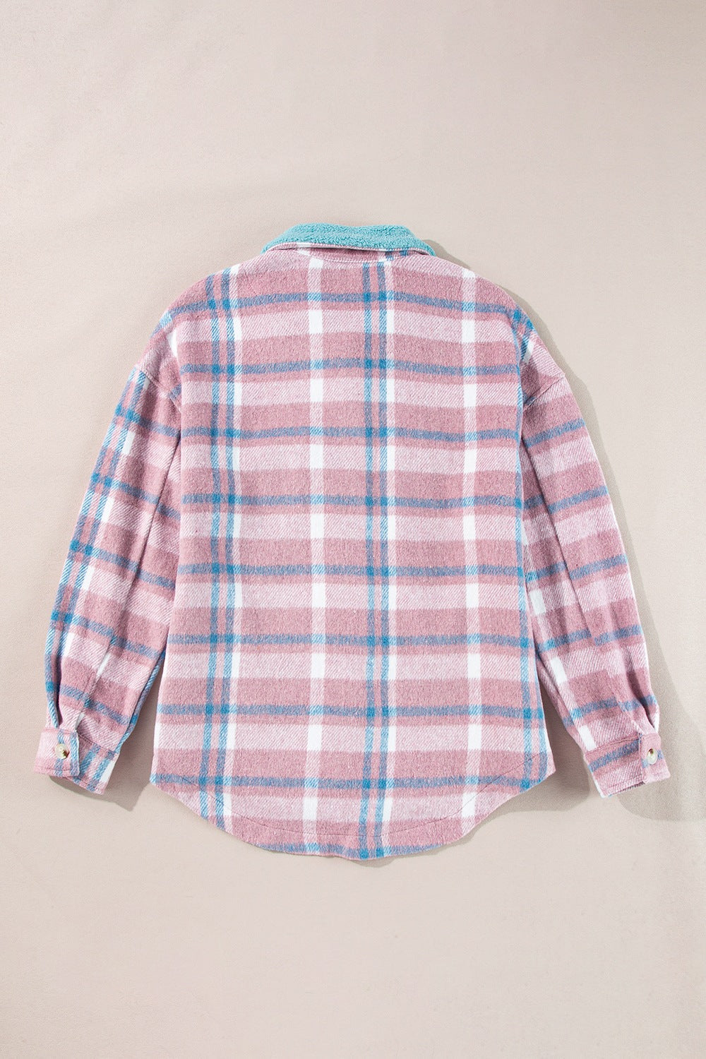 Pastel plaid shacket in dusty pink with a fuzzy blue contrast collar and button cuffs.