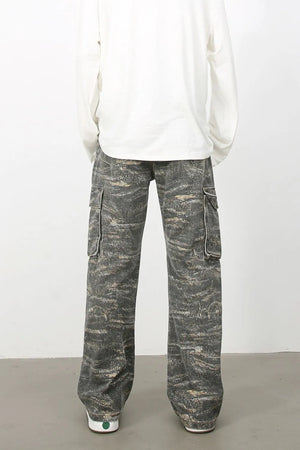 Distressed camo wide-leg cargo jeans in dark gray with utility pockets.