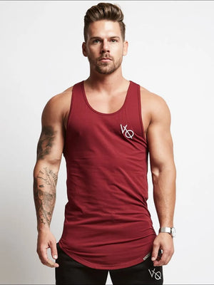 Men's rust racerback tank top with roundneck and subtle logo detail.