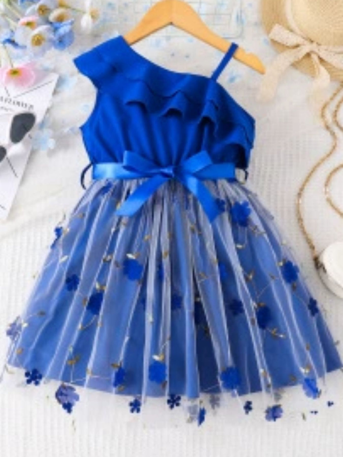 Toddler blue asymmetrical ruffled dress with floral embroidered tulle skirt and satin bow.