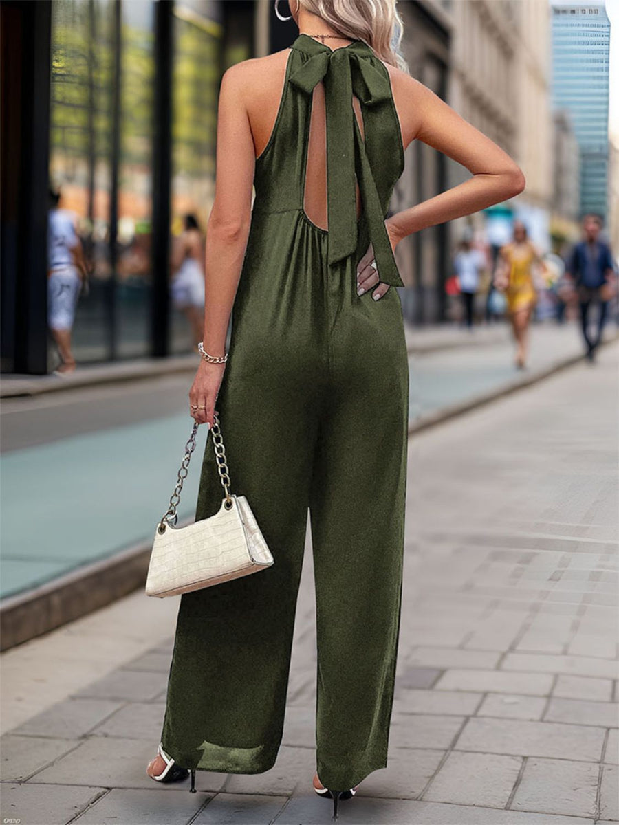 Dark green halter neckline wide leg jumpsuit with back tie detail.