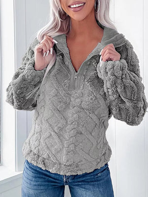 Gray textured fleece quarter zip sweatshirt with a relaxed fit and a corduroy collar.