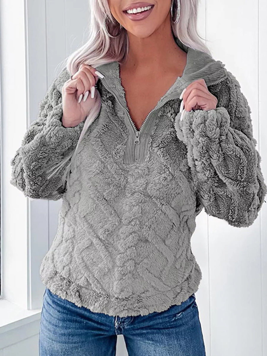 Gray textured fleece quarter zip sweatshirt with a relaxed fit and a corduroy collar.
