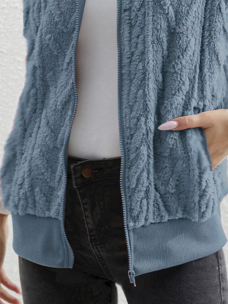 Blue faux fur zip-up vest with ribbed hem and pockets