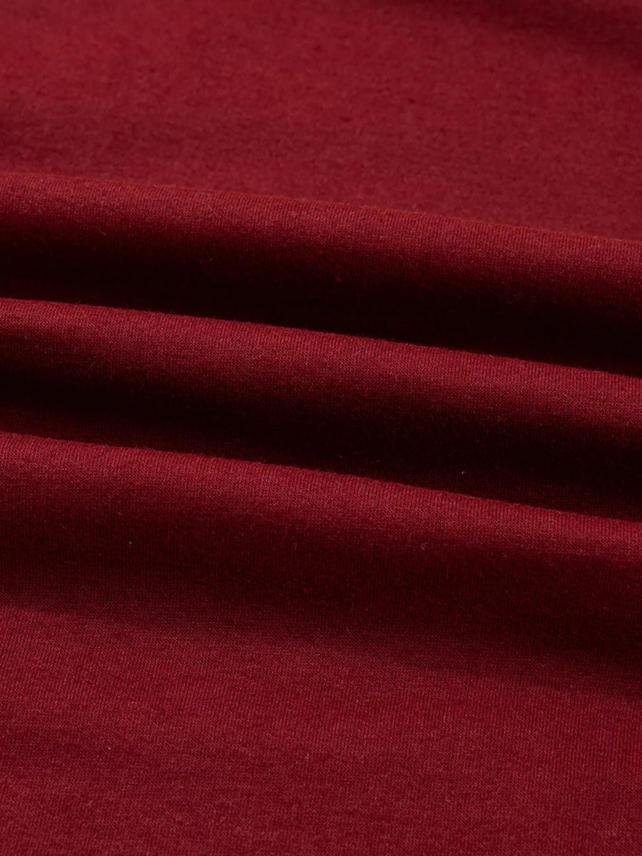 Burgundy long sleeve top with a soft, comfortable fabric texture.