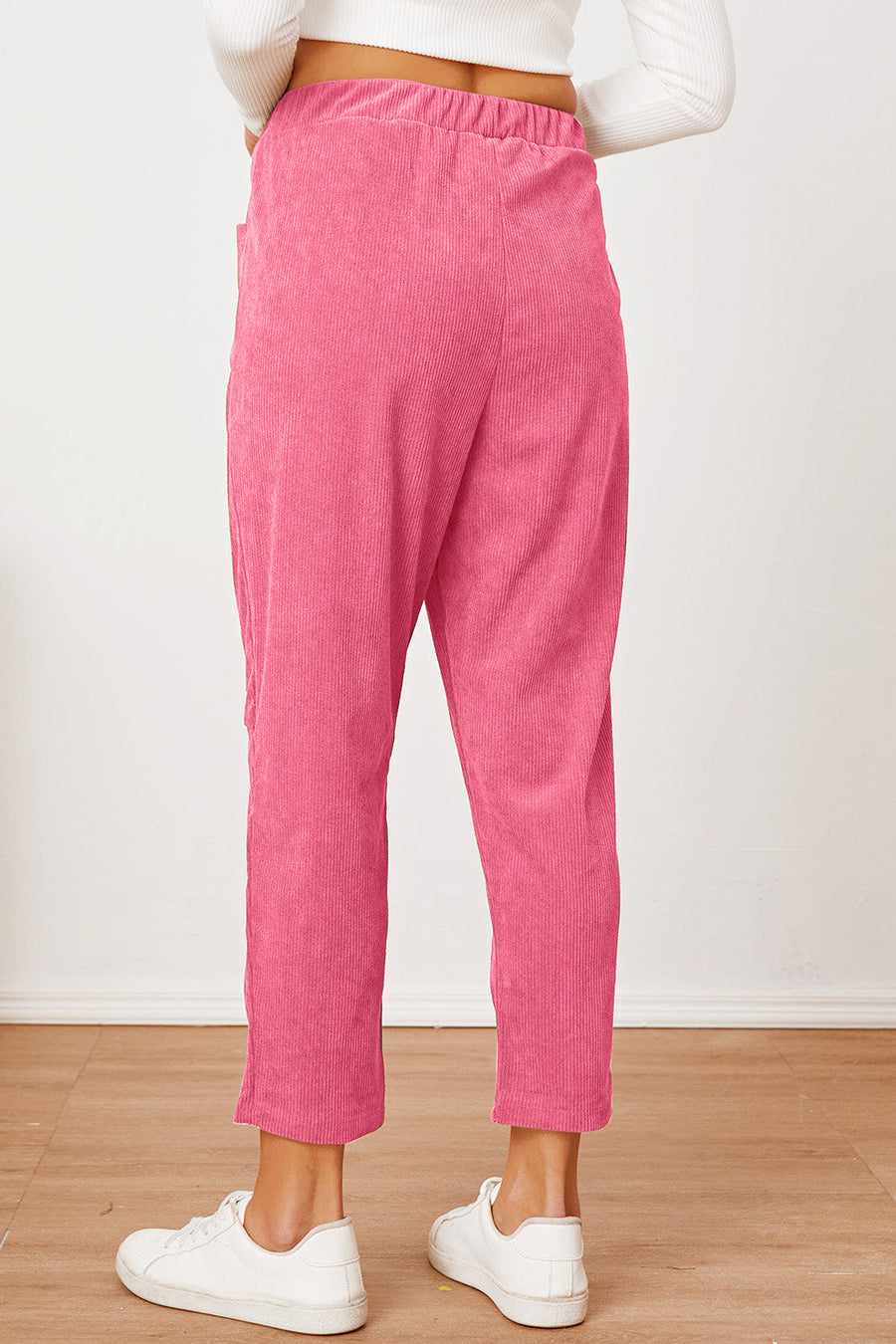 Hot Pink corduroy barrel-leg utility pants with elastic waist and pockets.