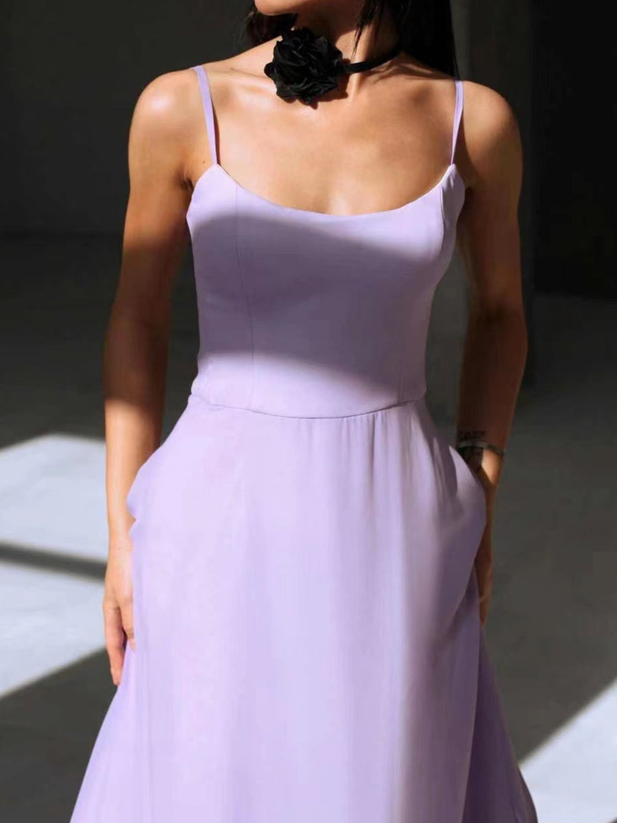 Lavender midi dress with spaghetti straps and pockets, styled with a black floral choker.