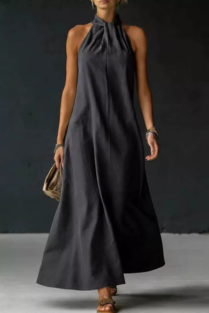 Black maxi dress with twisted halter neckline and A-line skirt