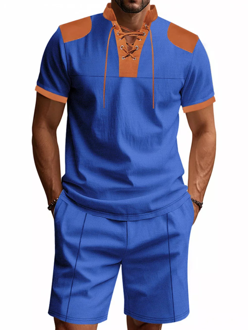 Men's sapphire blue two-piece set with lace-up detail and tan accents.