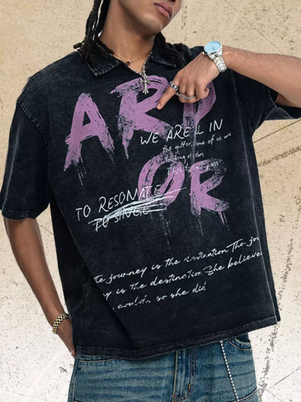 Black distressed graphic tee with relaxed fit and collared neckline.