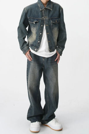 Relaxed fit denim trucker jacket in medium wash with chest pockets and button front.