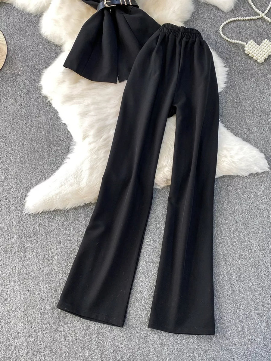 Black belted two-piece set with wide-leg pants and pockets.