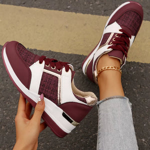 Burgundy textured lace-up sneakers with white and metallic accents and a chunky sole.