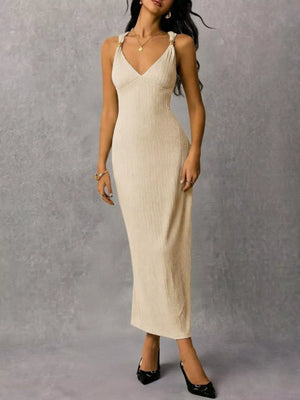 Ivory ribbed midi dress with V-neck and crisscross strap detail.