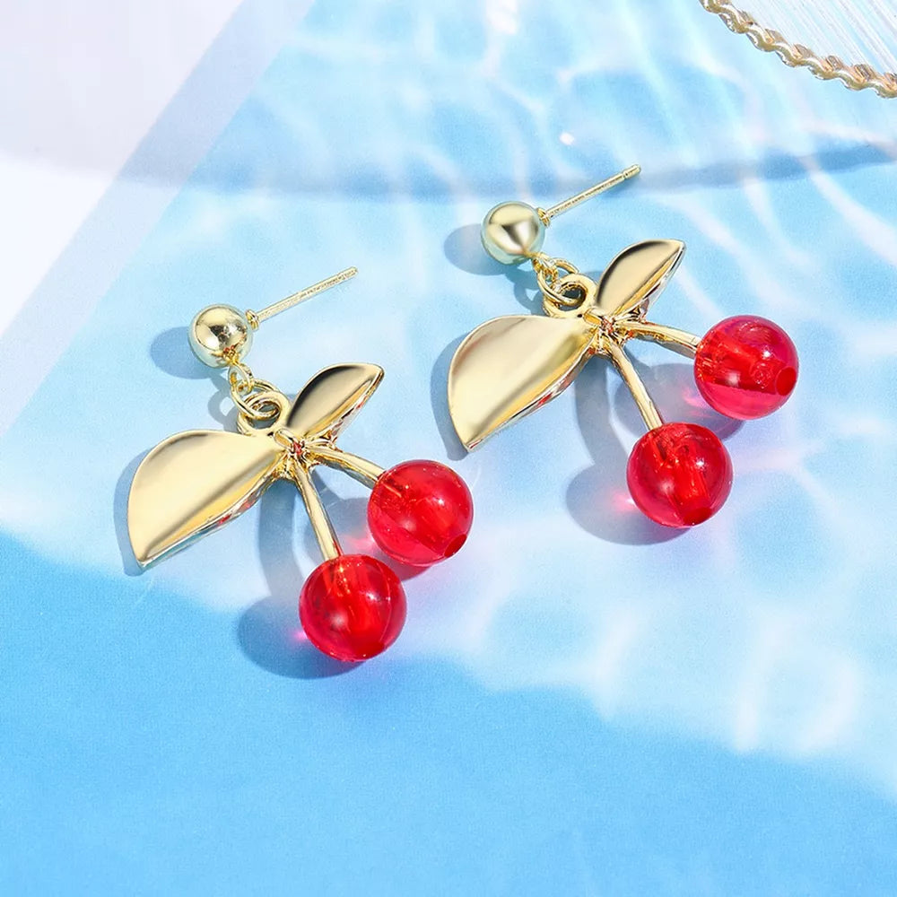 earrings in red featuring dangle design and dangle fit