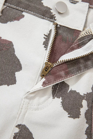 Cow print jeans with utility pockets and a zip fly closure.