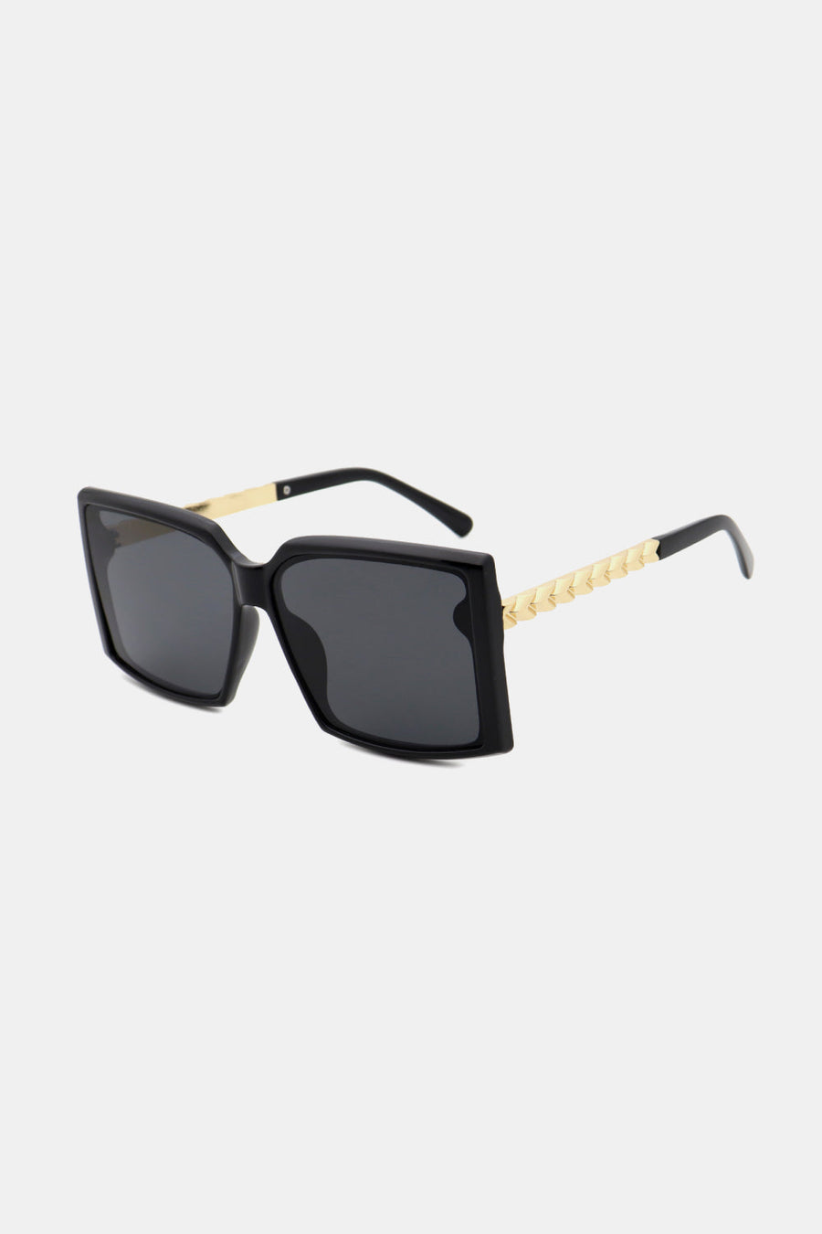 Black geometric sunglasses with gradient lenses and gold textured temples.