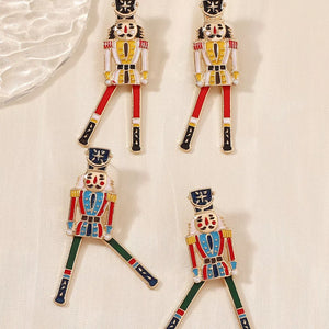 gold earrings with figural and not applicable