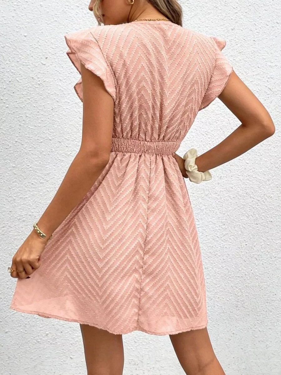Chevron textured V-neck mini dress in watermelon pink with flutter sleeves and defined waist