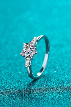 Silver ring with heart-cut moissanite and baguette accents