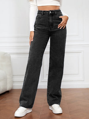 Black wide-leg denim jeans with a sculpted high rise, styled casually with white sneakers.