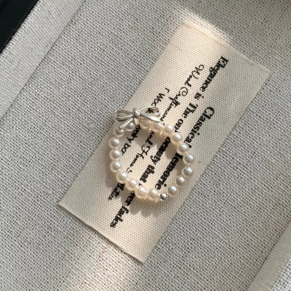 ring in ivory featuring pearl beaded and fitted fit