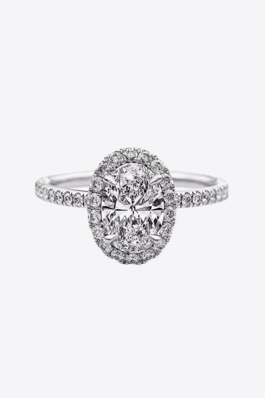 White gold oval diamond engagement ring with halo and diamond band