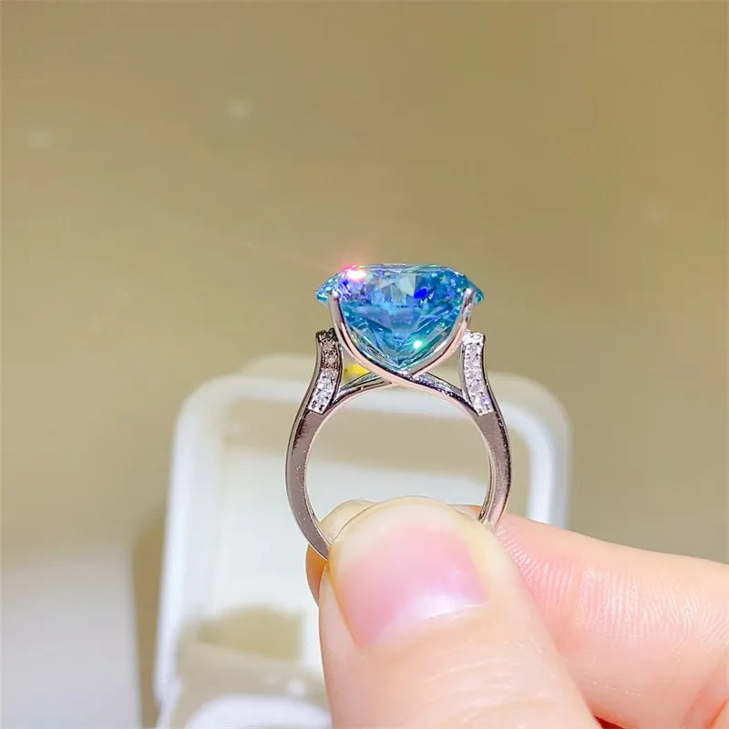 Silver ring with large blue stone and small accent stones