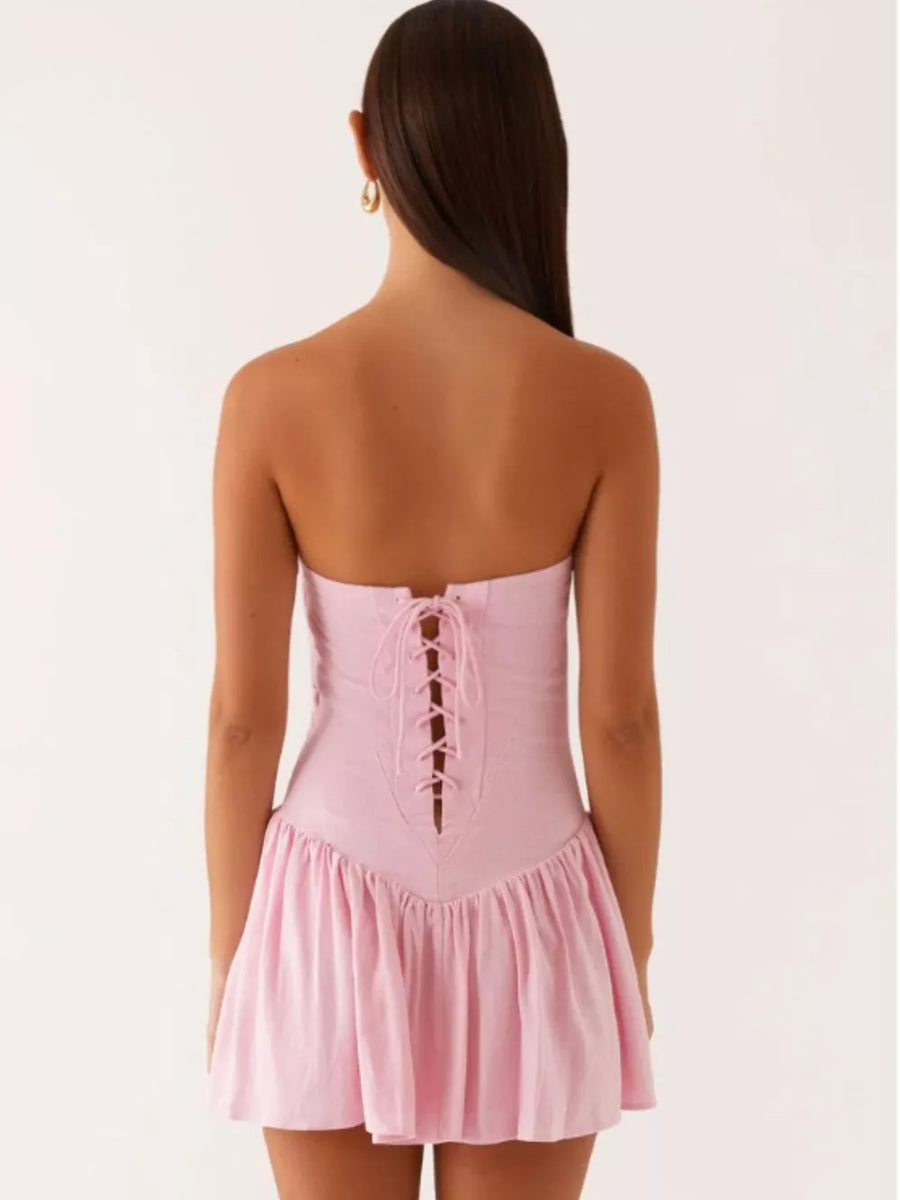 Pink ruffled tube dress with back lace-up tie detail