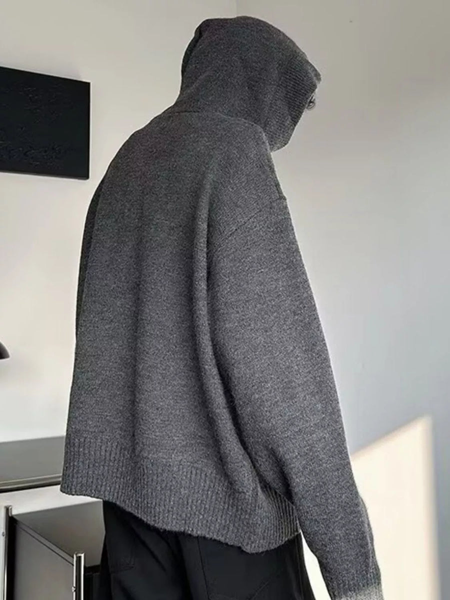 Gray knit hooded sweater with button detail, long sleeves, and ribbed hem.