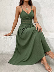 Green lace-embellished spaghetti strap maxi gown with cinched waist and V-neck.