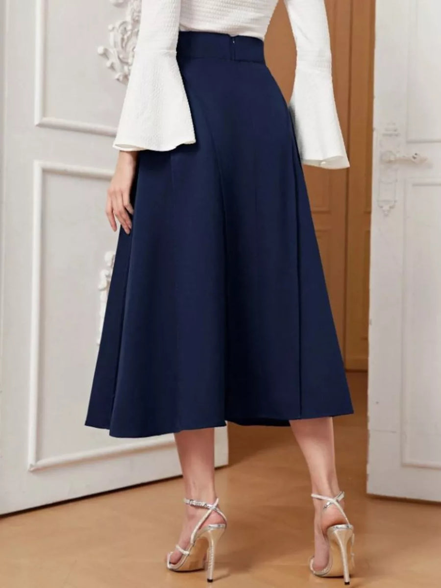 Navy midi skirt with a high waist and flared A-line cut, paired with white bell-sleeve top.