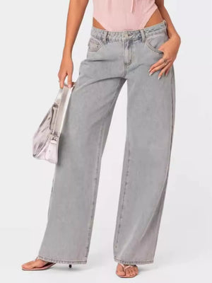 High-waisted relaxed fit light grey cotton blend jeans with buttoned closure and wide leg.