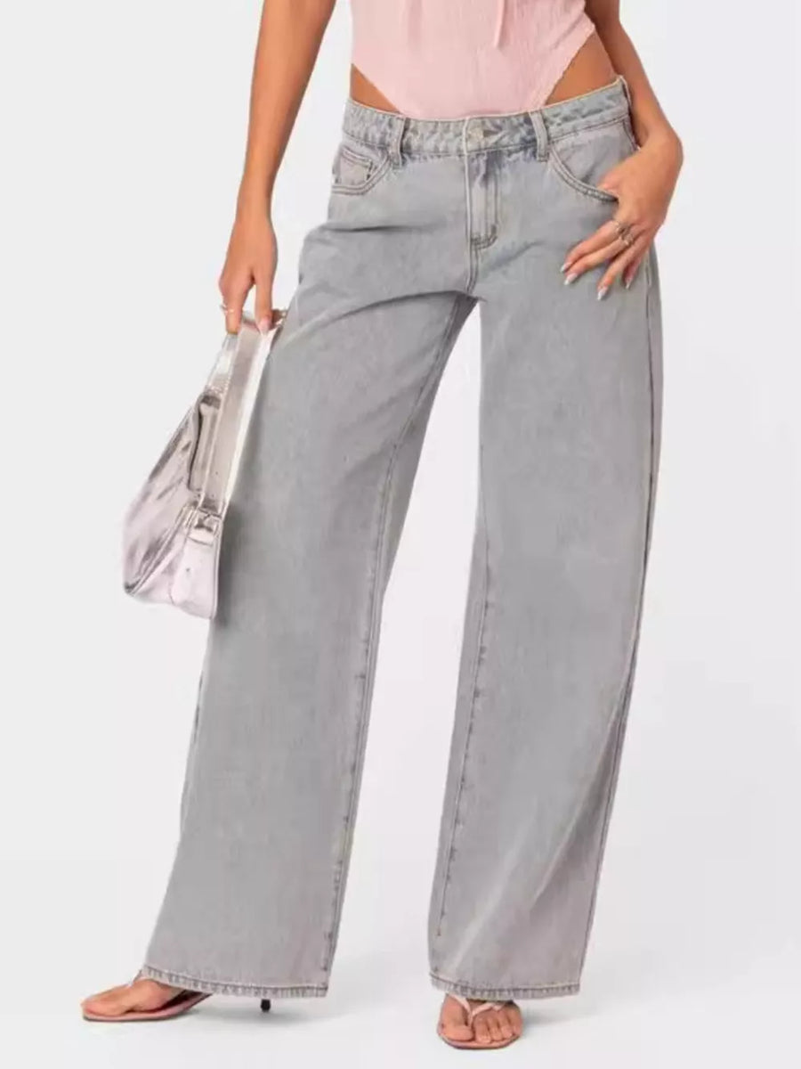 High-waisted relaxed fit light grey cotton blend jeans with buttoned closure and wide leg.