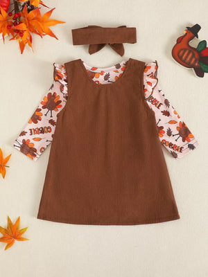 Brown corduroy turkey dress and bodysuit set with ruffled sleeves and headband.