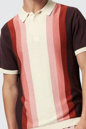 Gradient stripe knit polo shirt with cream, pink, and red stripes and a cream collar.